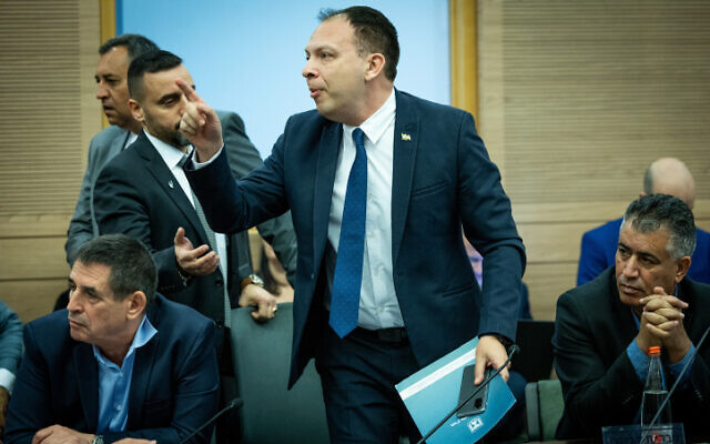 MK Vladimir Beliak is removed from the Knesset Constitution, Law and Justice Committee by Knesset orderlies during a committee hearing, January 11, 2023. (Yonatan Sindel/Flash90)