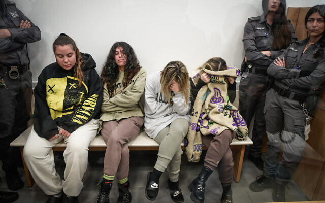Four women suspected of trying to smuggle 15kg of cocaine and ketamine from Germany into Israel, arrive for a court hearing in Lod on February 2, 2023. (Avshalom Sassoni/Flash90)