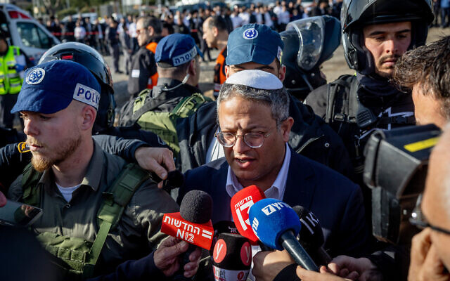National Security Minister Itamar Ben Gvir at the scene of a deadly terrorist car-ramming attack near the Ramot junction in Jerusalem on February 10, 2023. (Yonatan Sindel/Flash90)