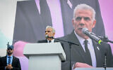 Leader of the opposition and Yesh Atid chairman MK Yair Lapid speaks at a protest against the government's judicial overhaul program outside the Knesset, February 13, 2023. (Arie Leib)