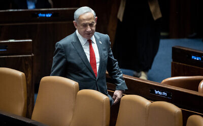 Prime Minister Benjamin Netanyahu arrives to a vote in the Knesset on February 15, 2023 (Yonatan Sindel/Flash90)