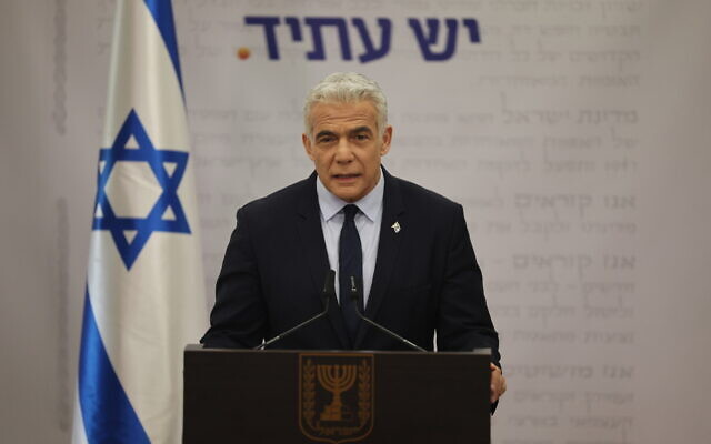 Yesh Atid MK Yair Lapid speaks during a faction meeting at the Knesset on February 20, 2023. (Yonatan Sindel/Flash90)