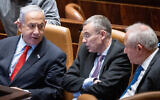 Prime Minister Benjamin Netanyahu (left), Justice Minister Yariv Levin (center) and Agriculture Minister Avi Dichter, in the Knesset on February 22, 2023. (Yonatan Sindel/Flash90)