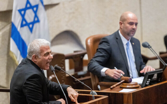 Opposition leader Yair Lapid speaks in the Knesset plenum on February 22, 2023. (Yonatan Sindel/Flash90)