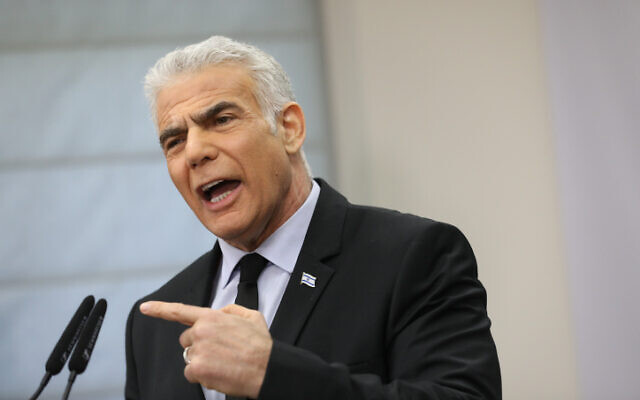 Head of the Yesh Atid party MK Yair Lapid speaks during a faction meeting at the Knesset on February 27, 2023. (Noam Revkin Fenton/Flash90)
