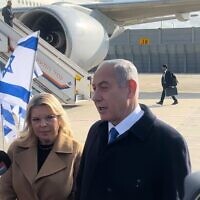 Prime Minister Benjamin Netanyahu (L)) and his wife, Sara, ahead of a flight from Tel Aviv to Paris on February 2, 2023. (Lazar Berman/Times of Israel)