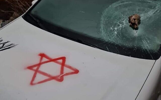 A car belonging to a Palestinian man graffitied with a Star of David during an alleged price tag attack east of the West Bank city of Hebron, February 14, 2013. (Social media screenshot: used in accordance with Clause 27a of the Copyright Law)