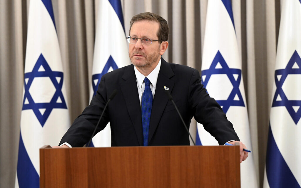 President Isaac Herzog delivers a message to the nation from his office in Jerusalem, February 12, 2023. (Haim Zach/GPO)