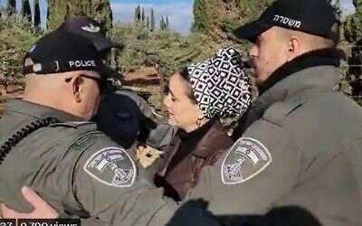 Otzma Yehudit MK Limor Son Har-Melech surrounded by police as she protests the removal of a West Bank settler's illegally planted orchard on February 15, 2023 (Screencapture/Twitter)