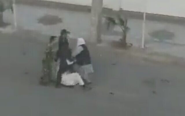 A screenshot from unverified social media video allegedly showing Iranian security forces beating a protester in Iran's southeastern city of Zahedan, February 24, 2022. (Twitter video screenshot; used in accordance with Clause 27a of the Copyright Law)