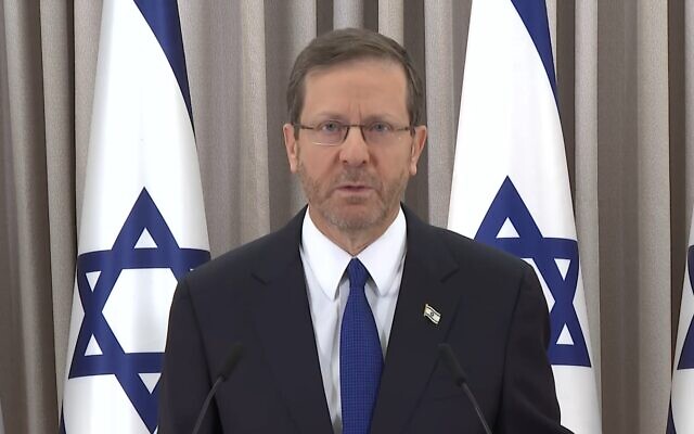 President Isaac Herzog delivers a message to the nation from his office in Jerusalem, February 12, 2023. (Screenshot/ Kan)