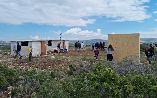 A photo sent out on February 12, 2023, shows settler activists at the illegal Gofna outpost in the West Bank. (Courtesy)