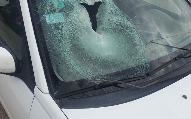 This handout photo shows the broken windshield on a car that was truck in an alleged Palestinian stone-throwing attack in the northern West Bank, February 23, 2023. (Courtesy)