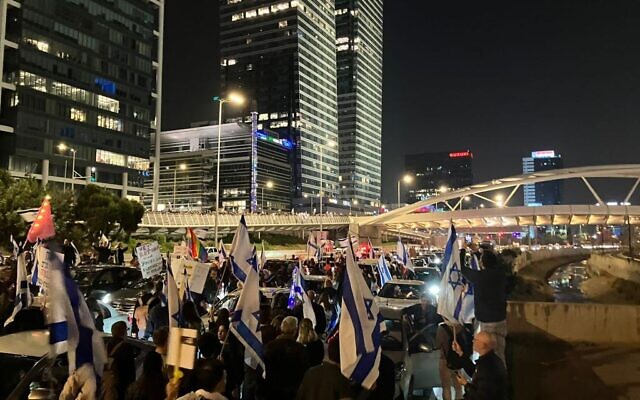 Protesters blocking the Ayalon Highway during an anti-government rally in Tel Aviv on February 25, 2023. (Times of Israel staff)