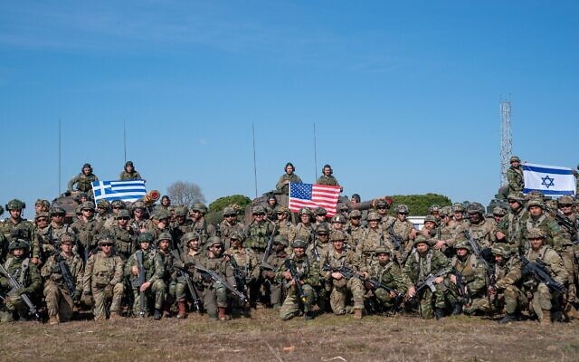 In this handout photo, Israeli, Greek, and American infantry forces post for a photo during a military drill in Greece, February 22, 2023. (Israel Defense Forces)