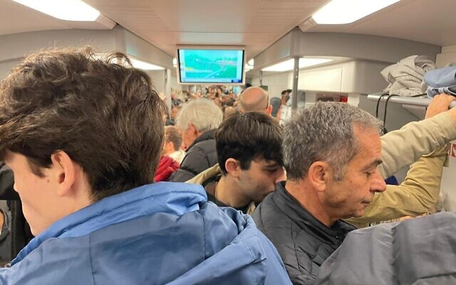 A packed train from Tel Aviv to Jerusalem as protesters travel to the Knesset, February 13, 2023 (Carrie Keller-Lynn)