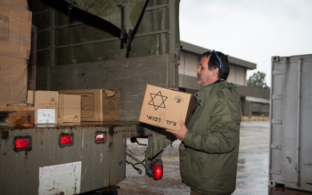 An IDF soldier prepares a shipment of aid and equipment for the search and rescue team departing to assist Turkey in the wake of a deadly earthquake on February 6, 2023. (Israel Defense Forces)