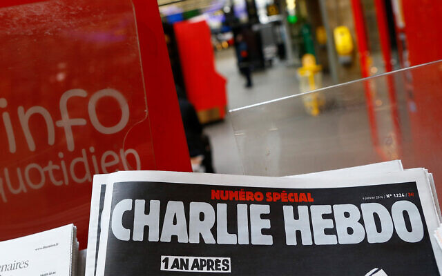 A special edition of the satirical newspaper Charlie Hebdo marking one year after the attacks on it, on a newsstand in Paris, January 6, 2016. (AP Photo/Francois Mori, File)