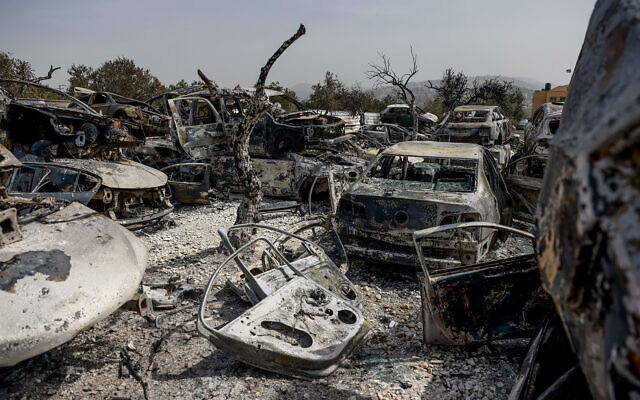 Cars burned by settlers during riots in Hawara, in the West Bank, near Nablus, February 27, 2023. (Erik Marmor/Flash90)