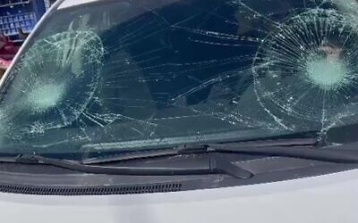 The shattered windshield of the vehicle of an Israeli man who drove into the Qalandiya refugee camp in the West Bank after he was attacked and stoned on February 14, 2023 (Screen capture/ Twitter: Used in accordance with Clause 27a of the Copyright Law)