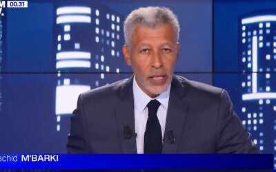 A screenshot from a BFMTV newscast in August 2022 featuring anchor Rachid M'Barki. (Screenshot via YouTube; used in accordance with Clause 27a of the Copyright Law)