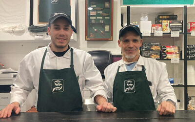 With nearly 35 years of experience at appetizing shops between them, Sean Brownlee, left, and Felix Placencia opened Simply Nova in East Williamsburg one year ago. (Lana Schwartz/ New York Jewish Week via JTA)