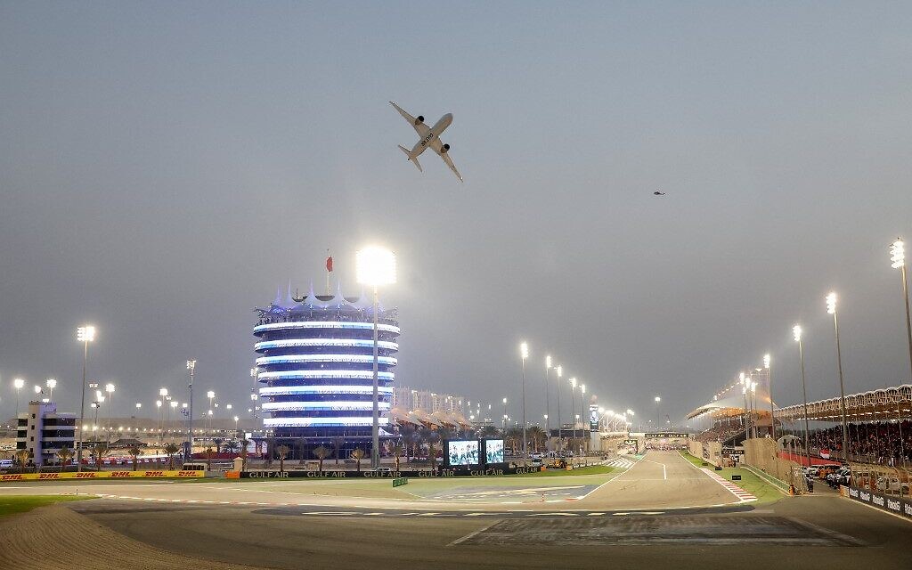 A Gulf Air Boeing 787-9 Dreamliner aircraft performs a flyover over the racetrack before the Bahrain Formula One Grand Prix at the Bahrain International Circuit in Sakhir on March 5, 2023. (Giuseppe Cacace/AFP)