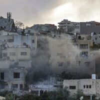 Smoke plumes billow during an Israeli army raid in Jenin in the West Bank on March 7, 2023. (Jaafar Ashtiyeh/AFP)