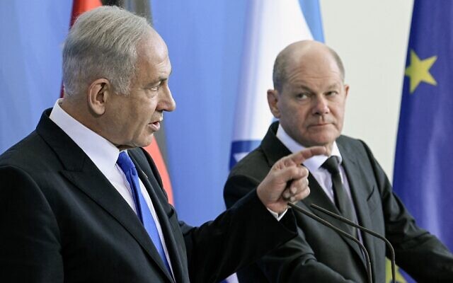 German Chancellor Olaf Scholz (R) and Prime Minister Benjamin Netanyahu speak during a joint press conference following talks at the Chancellery in Berlin on March 16, 2023. (Tobias Schwarz/AFP))