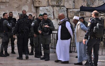 Israeli security forces stand guard as Muslim worshippers head to the Temple Mount compound to attend the first Friday prayers of the holy month of Ramadan, in Jerusalem's Old City, March 24, 2023. (Ronaldo Schemidt/AFP)