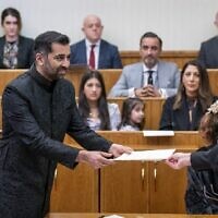 Leader of the Scottish National Party (SNP), Humza Yousaf, is sworn in as Scotland's first minister, the first Muslim in the role, at the Court of Session in Edinburgh on March 29, 2023. (Jane Barlow/Pool/AFP)