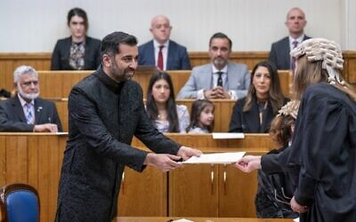 Leader of the Scottish National Party (SNP), Humza Yousaf, is sworn in as Scotland's first minister, the first Muslim in the role, at the Court of Session in Edinburgh on March 29, 2023. (Jane Barlow/Pool/AFP)