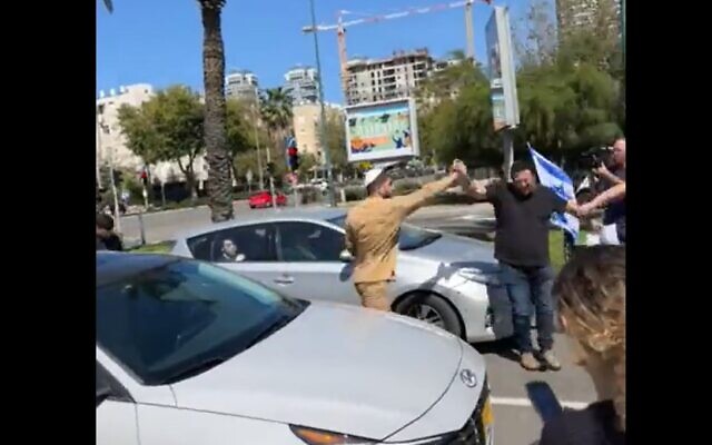 Ram Eyal, 24, threatens protesters with pepper spray at an anti-judicial overhaul rally in Tel Aviv, March 16, 2023. (Twitter video screenshot: used in accordance with Clause 27a of the Copyright Law)