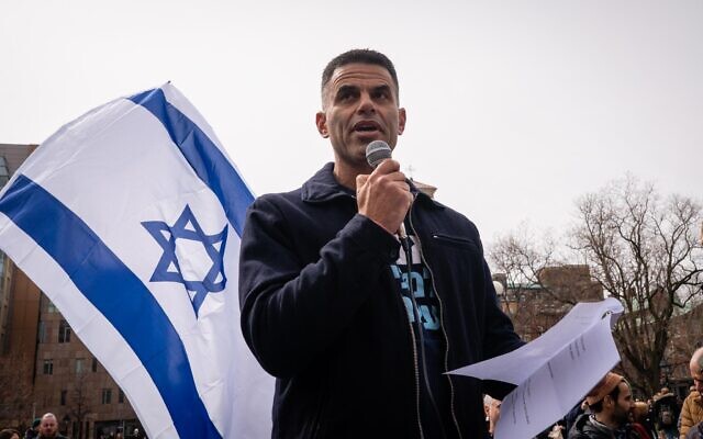 Col. (Res.) Ophir Bear, a 27-year Israeli Air Force fighter pilot, speaks against the government's judicial overhaul plans at a rally in New York City, March 12, 2023. (Luke Tress/Times of Israel)