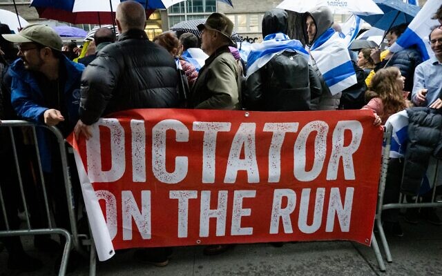 Protesters against the Israeli coalition's judicial overhaul and the Netanyahu government at a rally outside the Israeli consulate in New York City, March 27, 2023. (Luke Tress/Times of Israel)