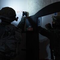 In this handout photo from March 10, 2023, Israeli troops map the home of terrorist Mutaz Salah al-Khawaja in the West Bank town of Ni’lin. (Israel Defense Forces)