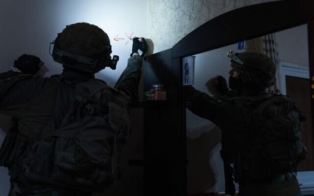 In this handout photo from March 10, 2023, Israeli troops map the home of terrorist Mutaz Salah al-Khawaja in the West Bank town of Ni’lin. (Israel Defense Forces)