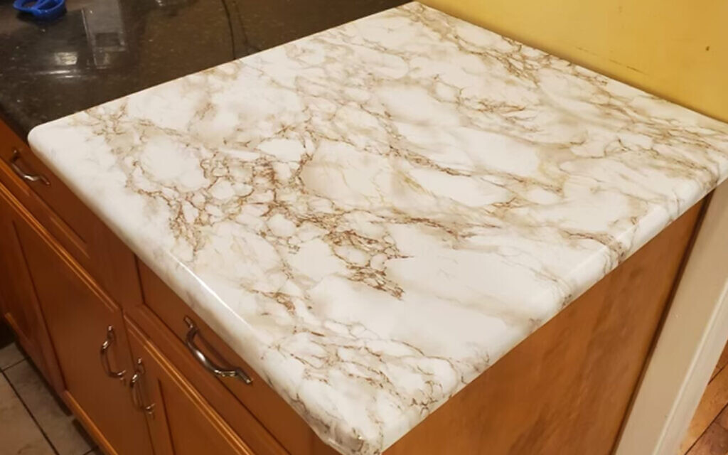 Kosher Dekal is coming back with a new design and formula for its countertop linings, which caused a scandal last year after customers had trouble taking them off their counters. (Courtesy via JTA)