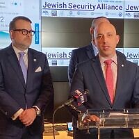 Anti Defamation League CEO Jonathan Greenblatt speaks at a press conference announcing the Jewish Security Alliance at the ADL's investigative research lab. Behind him is Scott Richman, the regional director of ADL’s New York-New Jersey Office, CSS CEO Evan Bernstein and CSI Executive Director Mitch Silber. (Jacob Henry via JTA)