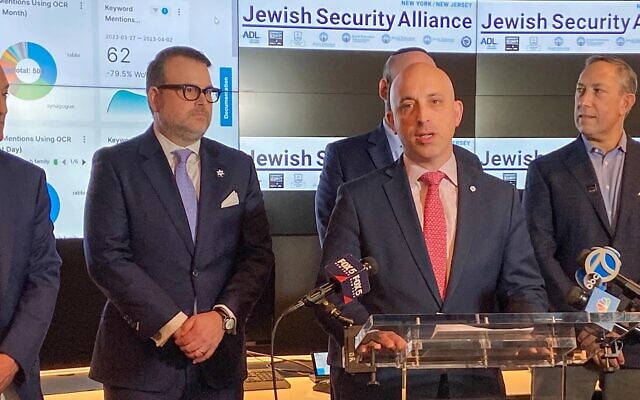 Anti Defamation League CEO Jonathan Greenblatt speaks at a press conference announcing the Jewish Security Alliance at the ADL's investigative research lab. Behind him is Scott Richman, the regional director of ADL’s New York-New Jersey Office, CSS CEO Evan Bernstein and CSI Executive Director Mitch Silber. (Jacob Henry via JTA)