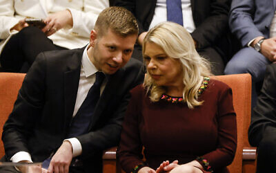Yair Netanyahu and Sara Netanyahu in the Knesset gallery as Prime Minister Benjamin Netanyahu's new government is sworn in at the Knesset in Jerusalem, on December 29, 2022. (AMIR COHEN / POOL / AFP)