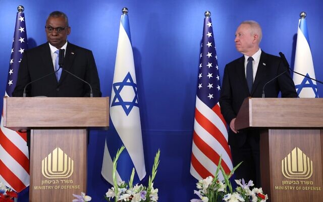 Defense Minister Yoav Gallant (R) and US Secretary of Defense Lloyd Austin deliver a statement to the press at the Israel Aerospace Industries (IAI) headquarters near the Ben Gurion airport in Tel Aviv, March 9, 2023. (GIL COHEN-MAGEN / AFP)