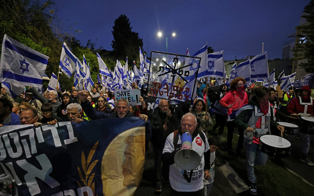 Protesters march during a rally against the government's controversial judicial overhaul bill in Tel Aviv on March 18, 2023. (Jalaa Marey/AFP)