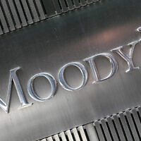 This Aug. 13, 2010 photo shows a sign for Moody's Corp. in New York. (AP Photo/Mark Lennihan)