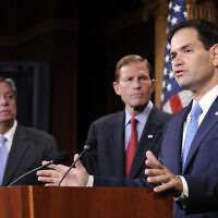 Sen. Marco Rubio, R-Fla., right, speaks during a news conference on the violence in the Mideast on Capitol Hill in Washington, Thursday, July 24, 2014. Standing with Rubio is Sen. Lindsey Graham, R-S.C., left, and Sen. Richard Blumenthal, D-Conn., center. (AP Photo)
