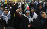 Schoolgirls chant slogans at a rally in Tehran, Iran, November 4, 2019. (Vahid Salemi/AP)