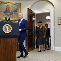 US President Joe Biden arrives to speak in the Roosevelt Room of the White House, May 4, 2022, in Washington. From left, Biden, Office of Management and Budget Director Shalanda Young and Cecilia Rouse, chair of the Council of Economic Advisers and Brian Deese. (AP Photo/Evan Vucci)