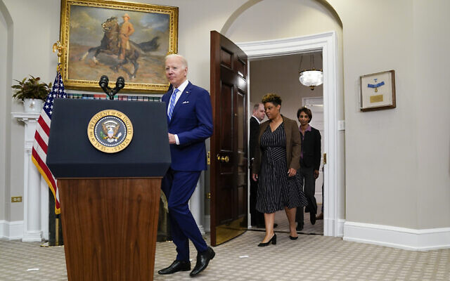 US President Joe Biden arrives to speak in the Roosevelt Room of the White House, May 4, 2022, in Washington. From left, Biden, Office of Management and Budget Director Shalanda Young and Cecilia Rouse, chair of the Council of Economic Advisers and Brian Deese. (AP Photo/Evan Vucci)