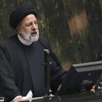 Iranian President Ebrahim Raisi addresses lawmakers while defending his next year's budget bill at the parliament in Tehran, Iran, January 22, 2023. (Vahid Salemi/AP)