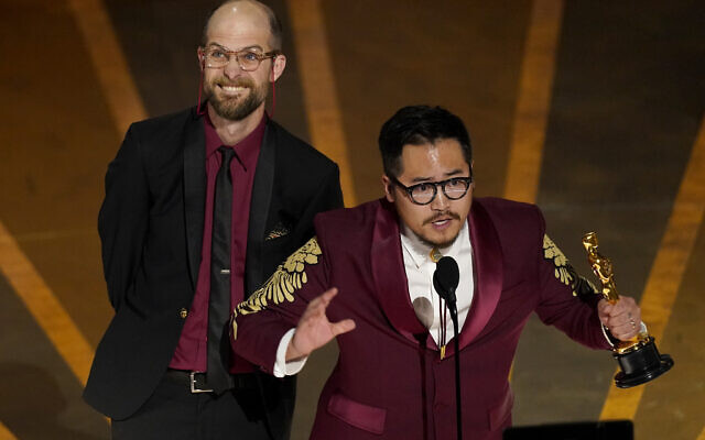 Daniel Scheinert, left, and Daniel Kwan accept the award for best director for "Everything Everywhere All at Once" at the Oscars on Sunday, March 12, 2023, at the Dolby Theatre in Los Angeles. (AP/Chris Pizzello)